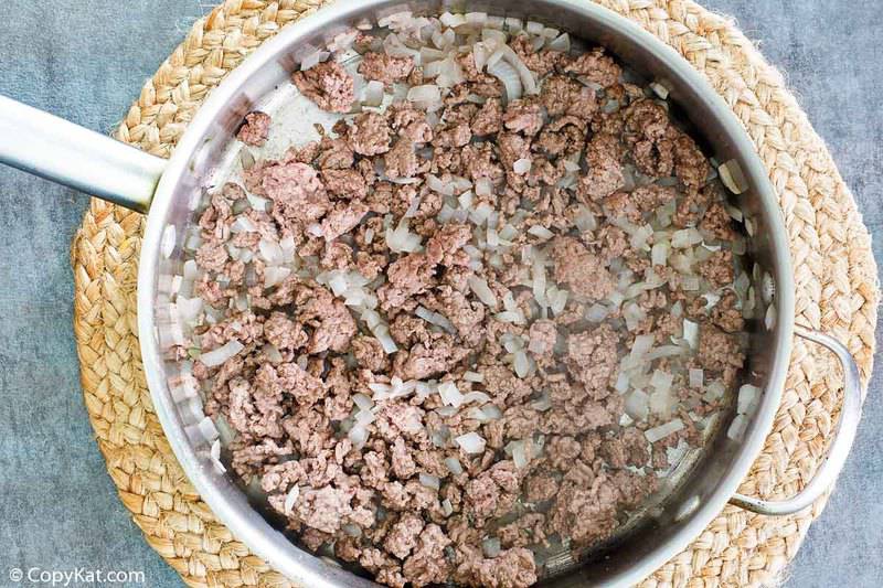 browned ground beef and onions in a skillet