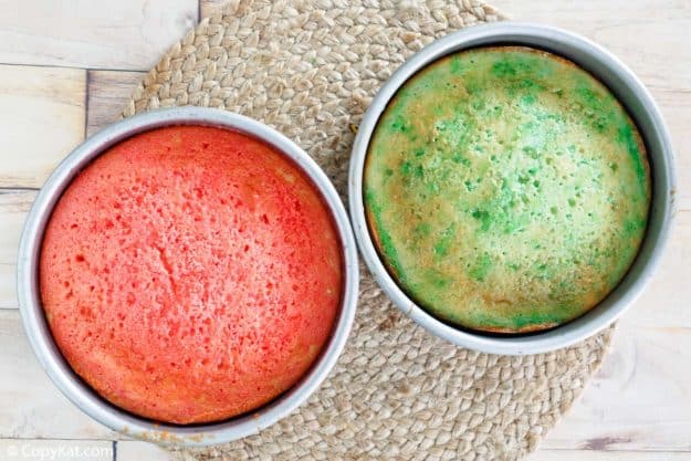 red and green Jello poke cake layers in the pans