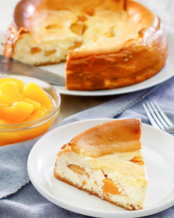 homemade Olive Garden Peach Cheesecake slice on a plate