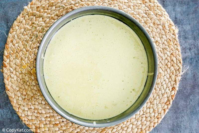 sponge cake batter in a springform pan