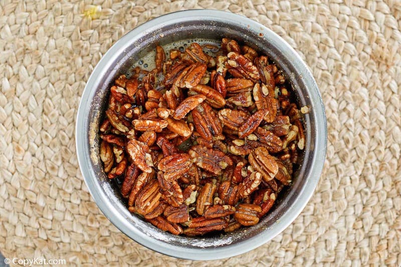 pecans and filling for pecan pie bars in a mixing bowl