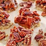 pecan pie bars on parchment paper