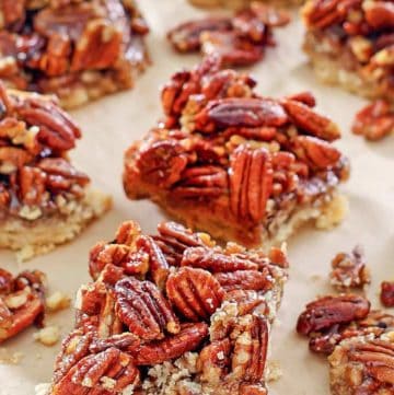 pecan pie bars on parchment paper