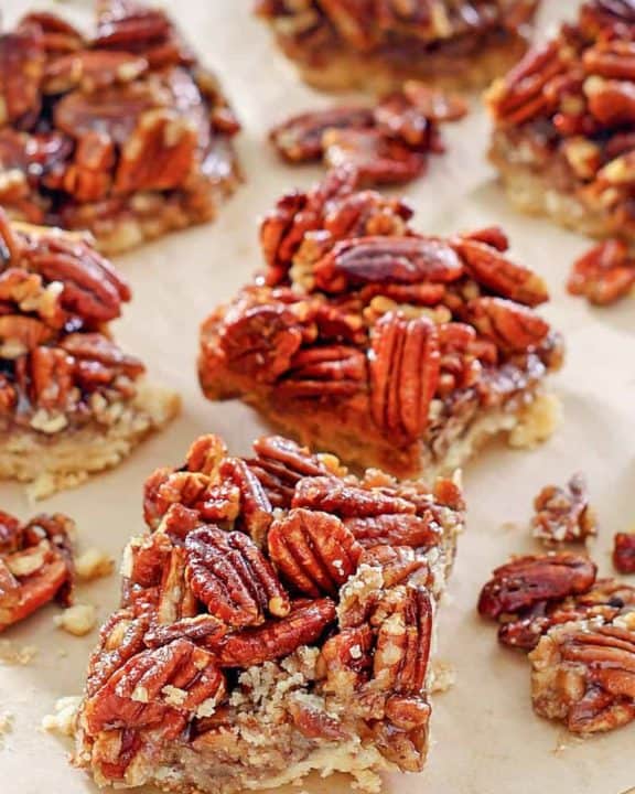 pecan pie bars on parchment paper