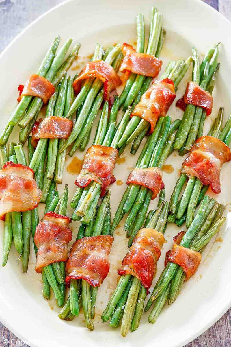 bacon wrapped green bean bundles on a platter