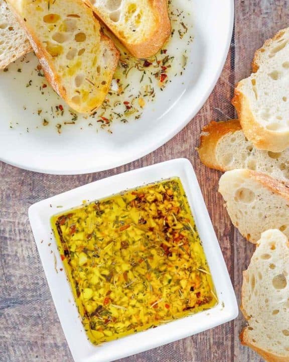 homemade Carrabba's Italian Butter Spicy Sicilian Dipping Sauce and bread slices