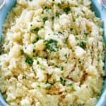homemade Cracker Barrel mashed potatoes in a blue serving dish