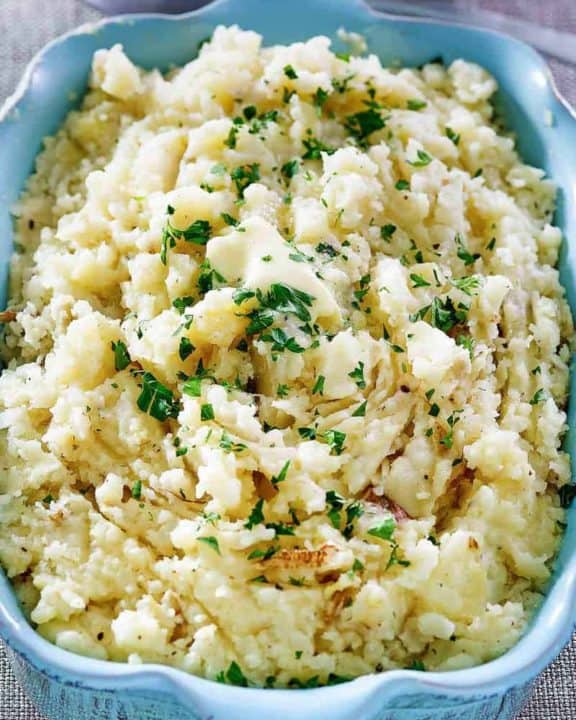 homemade Cracker Barrel mashed potatoes in a blue serving dish