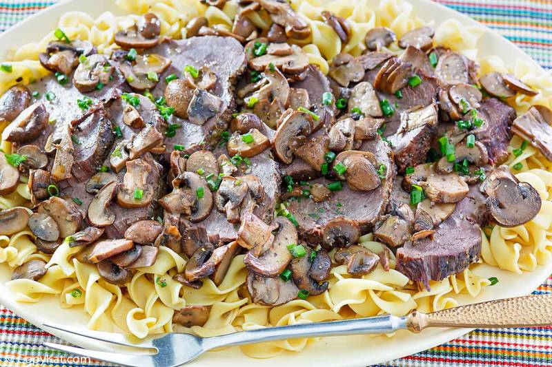 mushroom pot roast and noodles on a platter