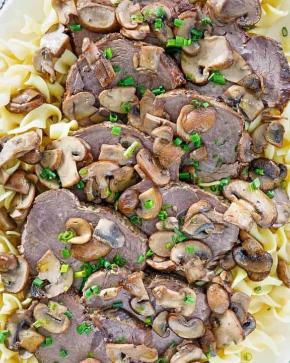 homemade Cracker Barrel mushroom pot roast and noodles on a platter