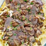 mushroom braised pot roast over noodles on a platter