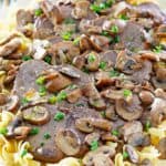 homemade Cracker Barrel Mushroom Pot Roast over noodles on a platter