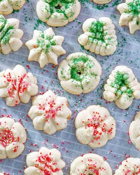cream cheese spritz cookies on parchment paper