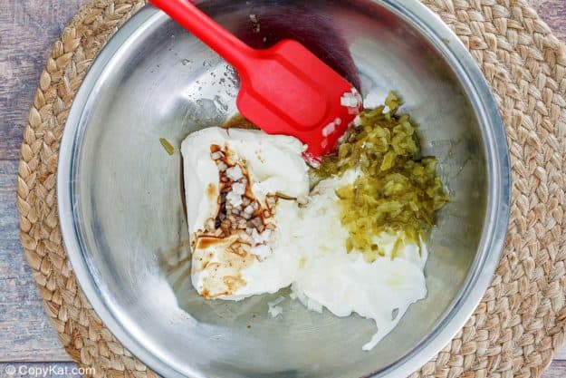 dill pickle dip ingredients in a mixing bowl
