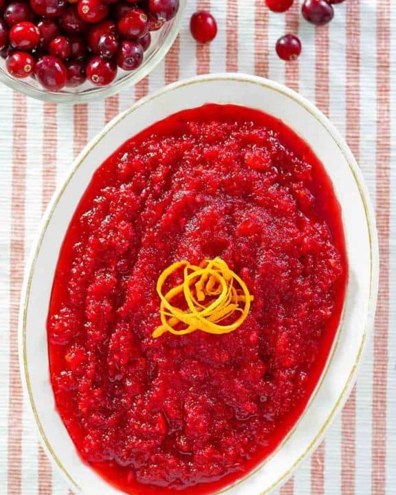 overhead view of a bowl of homemade Luby's cranberry relish and fresh cranberries