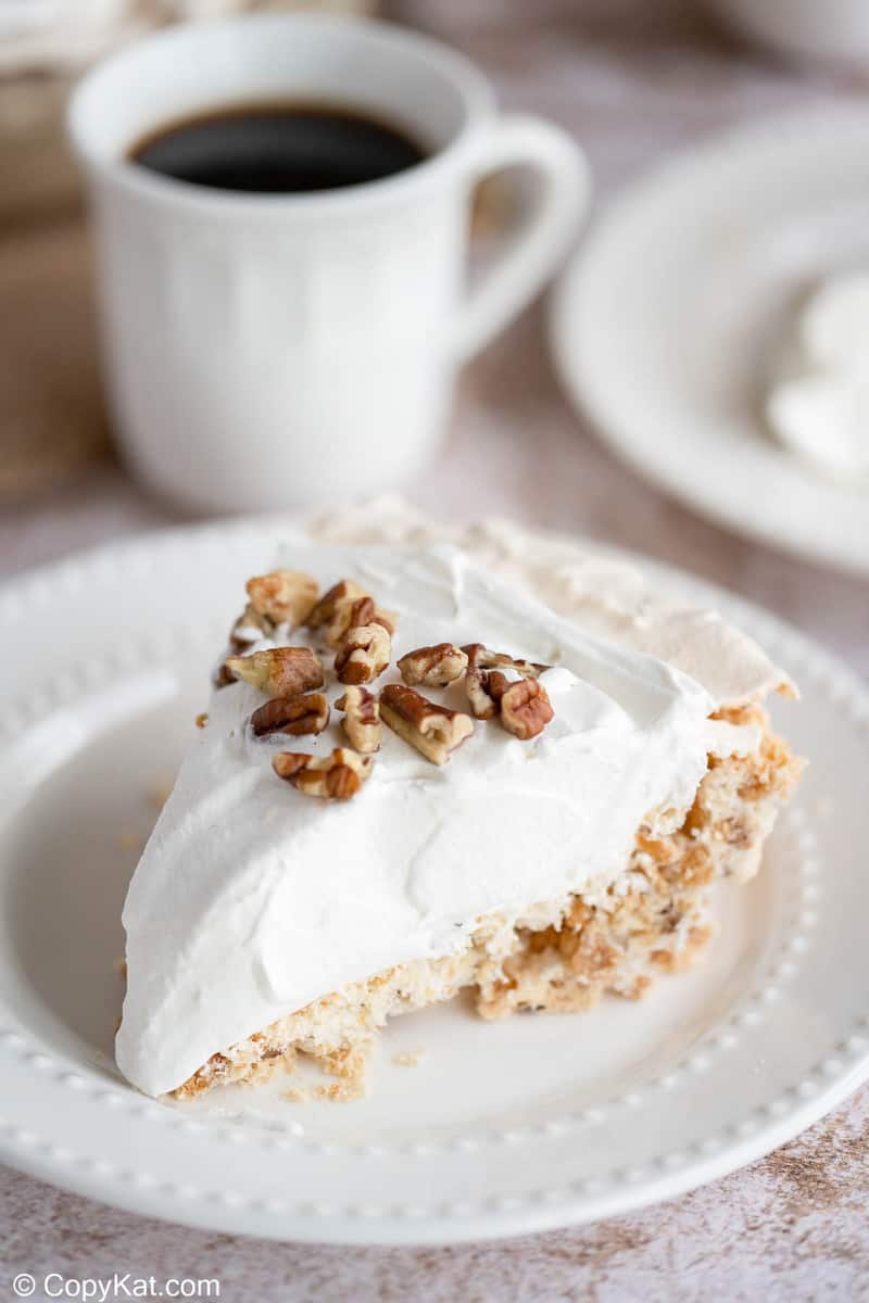 a slide of homemade Piccadilly pecan delight pie and a cup of coffee