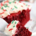 red velvet brownie piece on a fork in front of the brownie