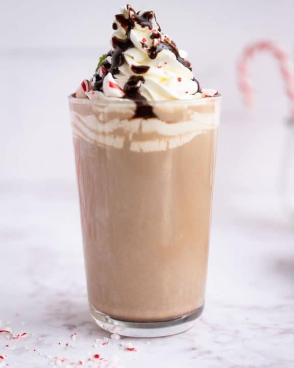 homemade Starbucks Peppermint Mocha with whipped cream, chocolate syrup, and peppermint candy