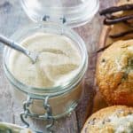 a jar of homemade vanilla sugar and blueberry muffins