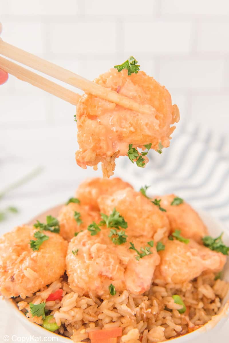 bang bang shrimp being held by chopsticks