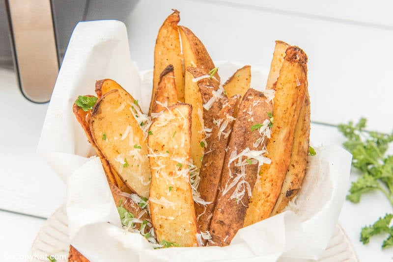 air fryer potato wedges in a serving dish