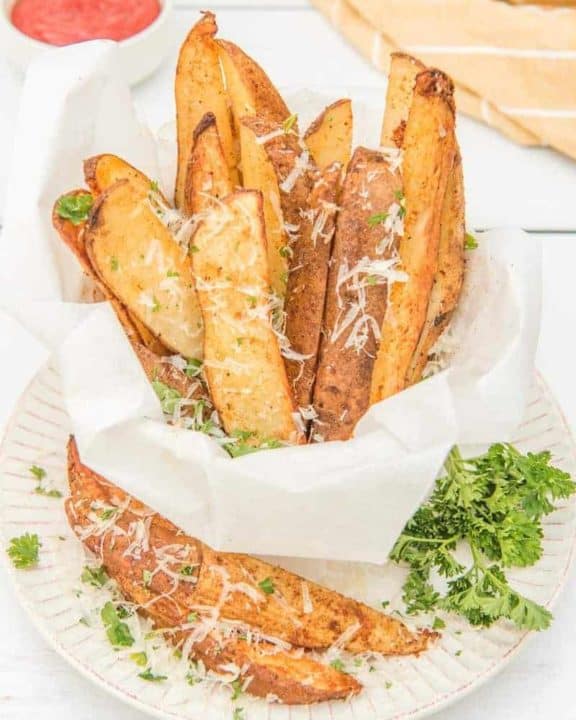 air fried potato wedges sprinkled with parmesan cheese and parsley