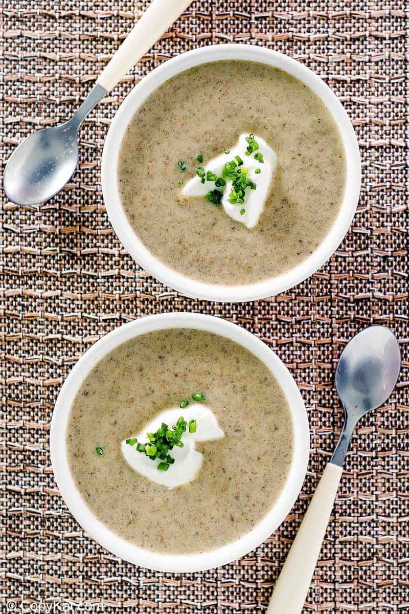 overhead view of two bowls of homemade gluten-free cream of mushroom soup