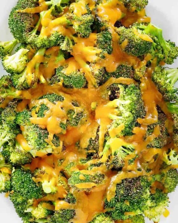 overhead view of Keto oven roasted broccoli and cheese on a platter