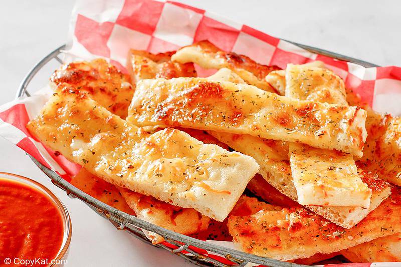 a basket of homemade Little Caesar's Italian Cheese Breadsticks