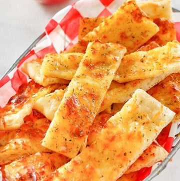 a basket of homemade Little Caesar's Italian cheese breadsticks