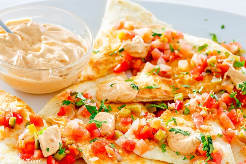homemade Taco Bell quesadilla sauce in a bowl and on quesadillas
