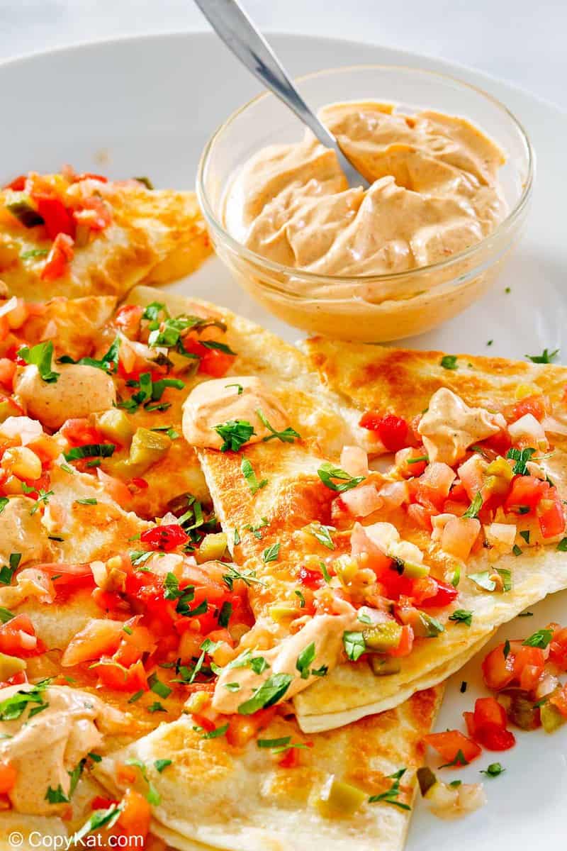 quesadillas and a bowl of homemade Taco Bell quesadilla sauce