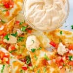 a bowl of homemade Taco Bell quesadilla sauce and quesadillas on a plate