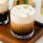 White Russian cocktail on a serving tray