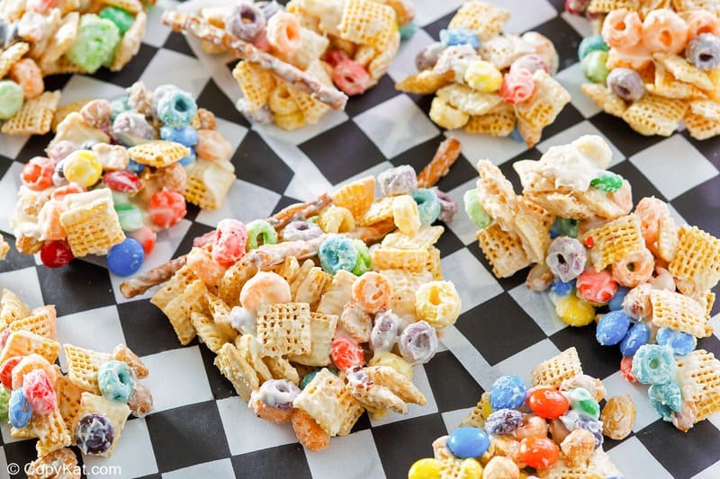 white trash candy snack pieces on black and white checkered parchment paper