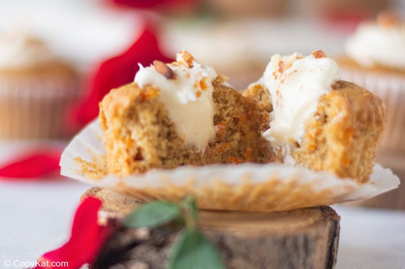 split open carrot cake cupcake with cream cheese filling