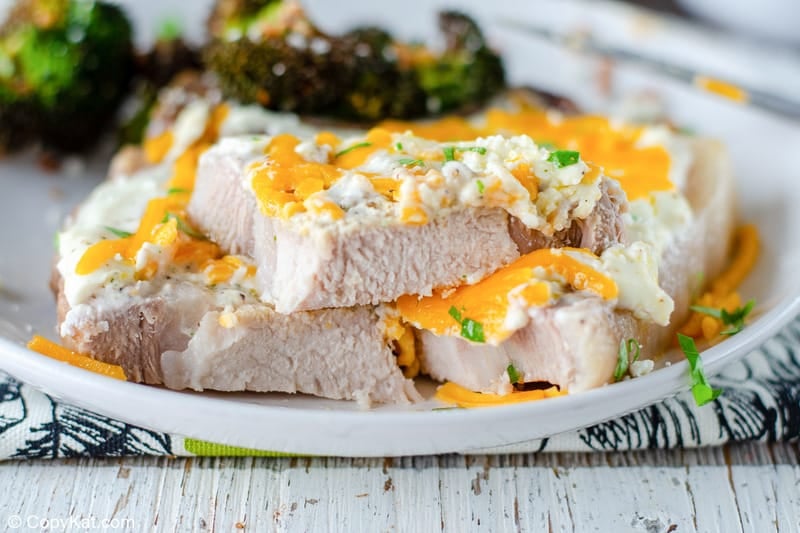 cut up cheese sour cream baked pork chop on a plate