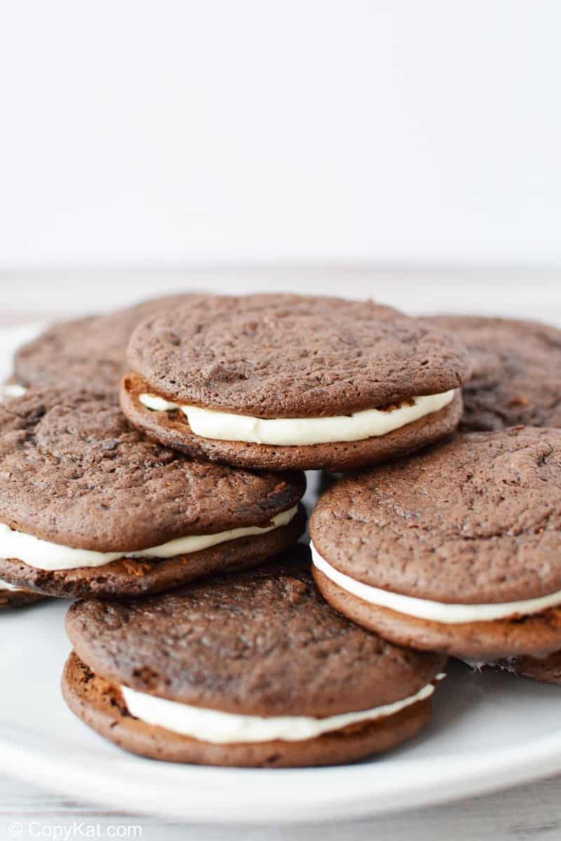 a pile of chocolate sandwich cookies on a plate