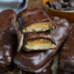 homemade Twix bars stacked on a wood board