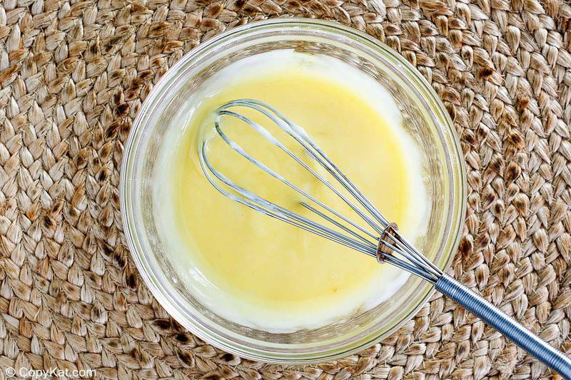 Kozy Shack rice pudding mixture and a whisk in a bowl