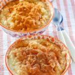 two bowls of homemade Kozy Shack rice pudding topped with cinnamon