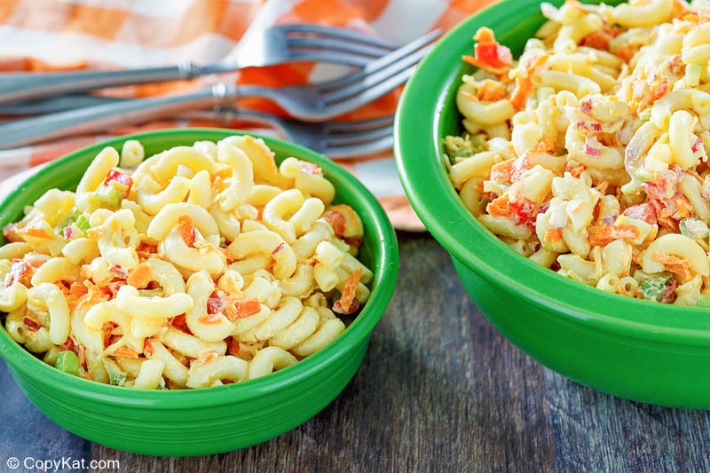 two bowls of homemade macaroni salad and three forks