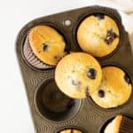 homemade Magnolia Bakery blueberry muffins in a muffin tin
