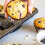 hand holding a blueberry muffin