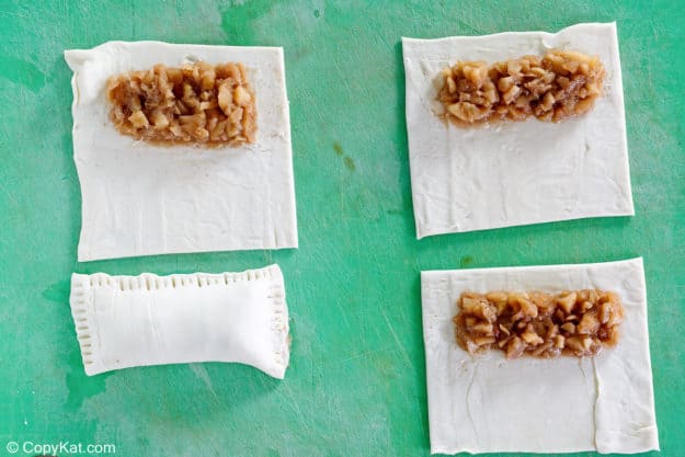 apple pie filling on puff pastry sheets