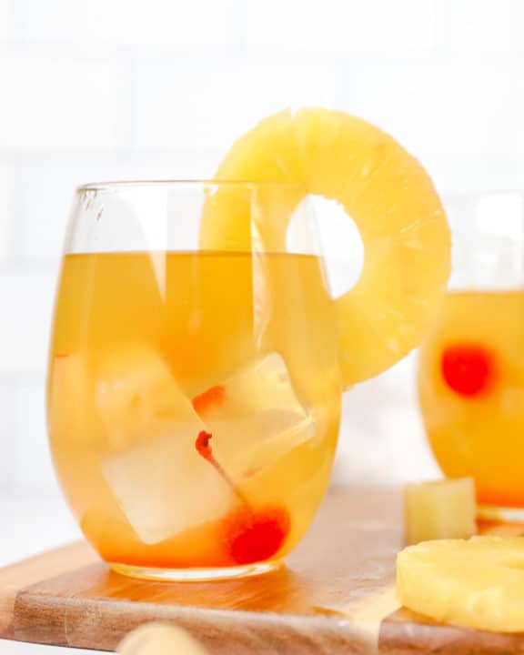 pineapple white wine sangria garnished with fresh pineapple ring