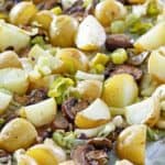 roasted leeks, potatoes, and mushrooms on a sheet pan