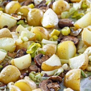 roasted leeks, potatoes, and mushrooms on a sheet pan