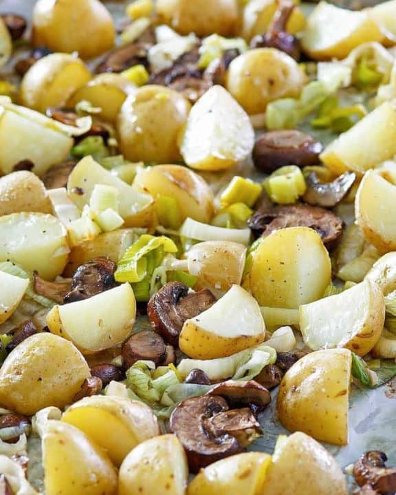 roasted leeks, potatoes, and mushrooms on a sheet pan