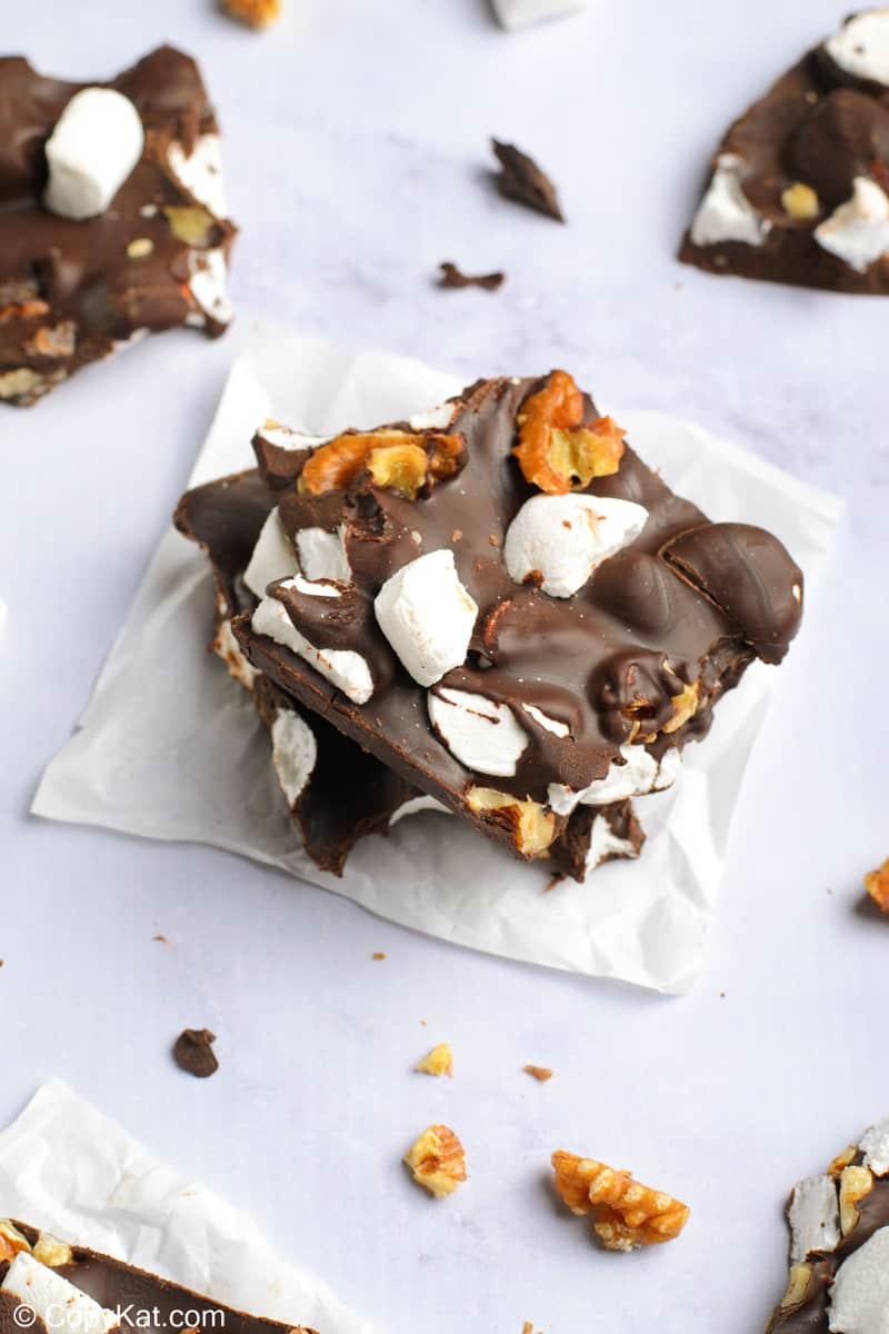 rocky road candy with walnuts stacked on parchment paper